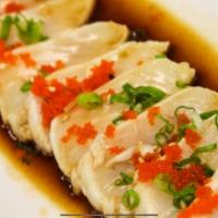   White Tuna Tataki · 7 pieces. Raw. Seared salmon, topped with scallions and tobiko. Served with ponzu sauce.