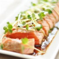   Salmon Tataki · 7 pieces. Raw. Seared salmon, topped with scallions and tobiko. Served with ponzu sauce.