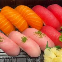 Torio Sushi   · Raw. 3 pieces tuna, 3 pieces salmon, and 3 pieces yellowtail.