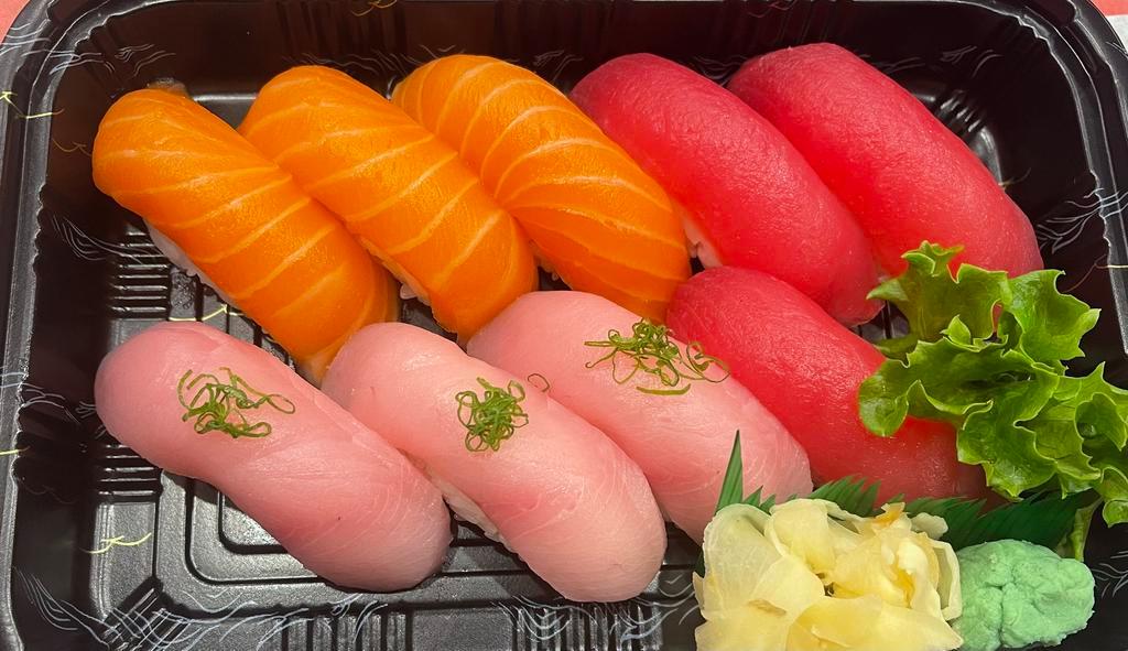 Torio Sushi   · Raw. 3 pieces tuna, 3 pieces salmon, and 3 pieces yellowtail.