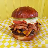 Pub Burger · 1/2 lb. Burger Specially Seasoned on Pretzel Bun with Bacon, Cheddar Cheese & onion straws. ...