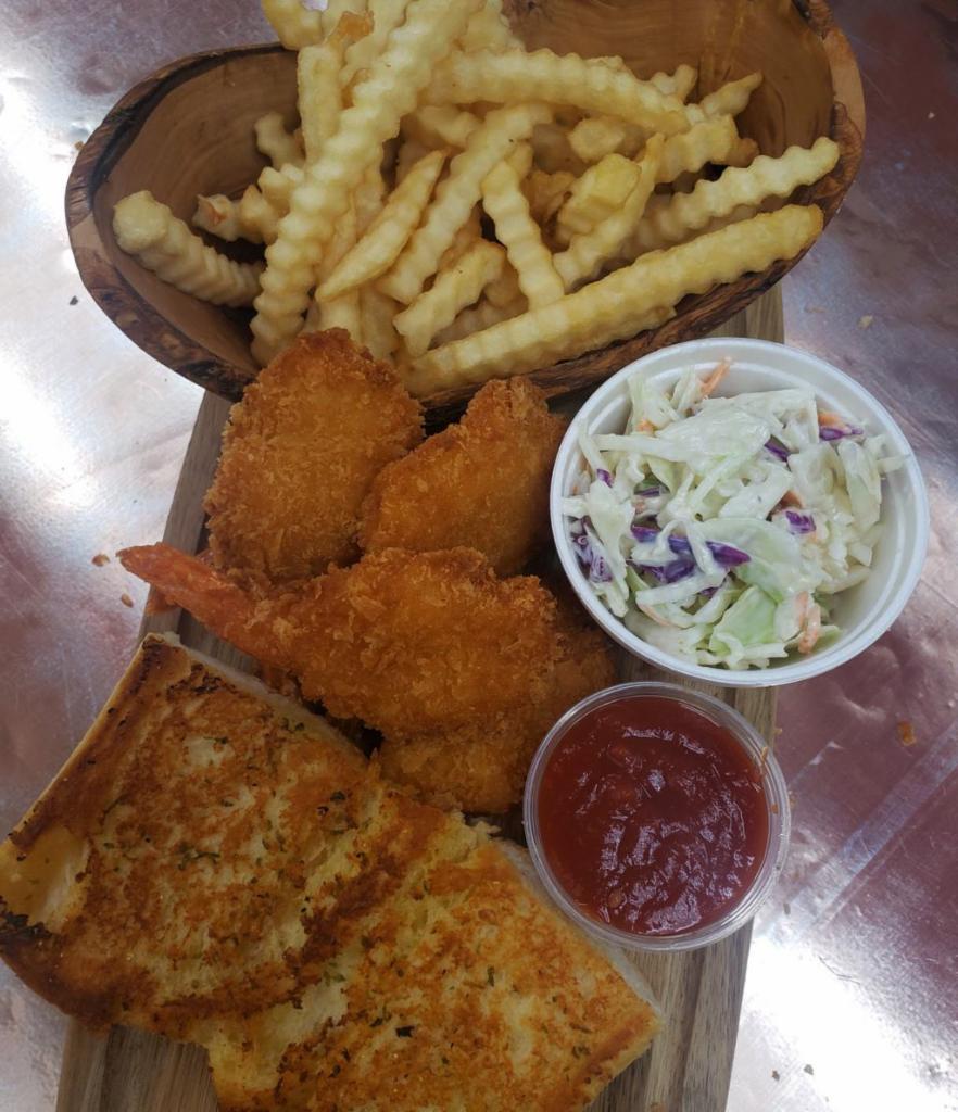 Shrimp Dinner · Five Pieces of Butter Fly Shrimp Served with Fries, Cole Slaw & Garlic Bread.  Includes Two small Cups of Sauce.