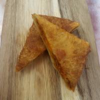 Pizza Puff · Deep Fried Puff Pastry filled with Beef & A Blend of Cheese & Sauce.