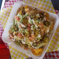Loaded Nacho · Includes melted cheese sauce, taco meat, lettuce, tomatoes, shredded cheese, sour cream and ...