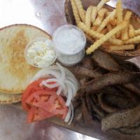 Gyro Plate · 2 pitas, meat, side of feta, 2 cups tzatziki, tomatoes and onions, with a small fry.
