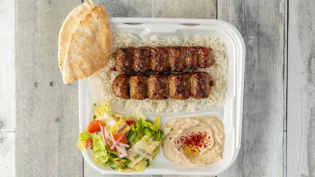Beef Luleh Kabob Plate · Spice-infused ground beef that is charbroiled. Served with rice pilaf, fresh garden salad, soft pita bread, and hummus.