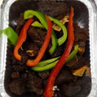 Tassot Kabrit · Fried goat. Tender fried goat with rice and beans or white rice.
