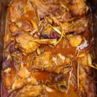 Stew Chicken · Poulet. Herb seasoned assorted chicken fried or stew with white rice or rice and beans.