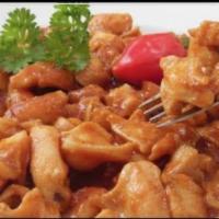 Lambi · Tenderized ocean conch stewed in creole sauce, with white rice or rice and beans.