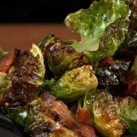 crispy brussel sprouts · fresh brussel sprouts lightly fried and top with Indonesian style sweet soy sauce