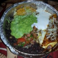 44. Stewed Chicken Enchilada · Rolled soft corn tortilla filled with Monterey Jack cheese with a choice of sauce, topped wi...