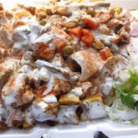 Mix over rice and free soda  · SERVED WITH 
CHICKEN AND LAMB , RICE ,SALAD AND FREE SODA 
DRESSING OF YOUR CHOICE 