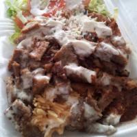 Lamb over rice and free soda  · SERVED WITH 
LAMB , RICE ,SALAD AND FREE SODA 
DRESSING OF YOUR CHOICE 
