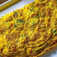 Desi Omelette · Omelette is made with onions, tomatoes, and chilies.