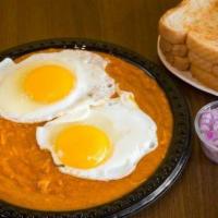 Surti Gotalo · Shredded hard-boiled eggs mixed with a sunny side up in special holic spices.