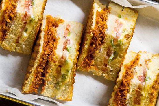 Chicken Masala Sandwich · Double layered grilled cheese sandwich with marinated tandoori chicken and veggies.