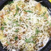 Cheese Samosa Chaat · Samosa chaat topped with Indian cheese.