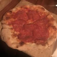 Piccante Pizza · Spicy salami, Gorgonzola, mozzarella and light tomato sauce.