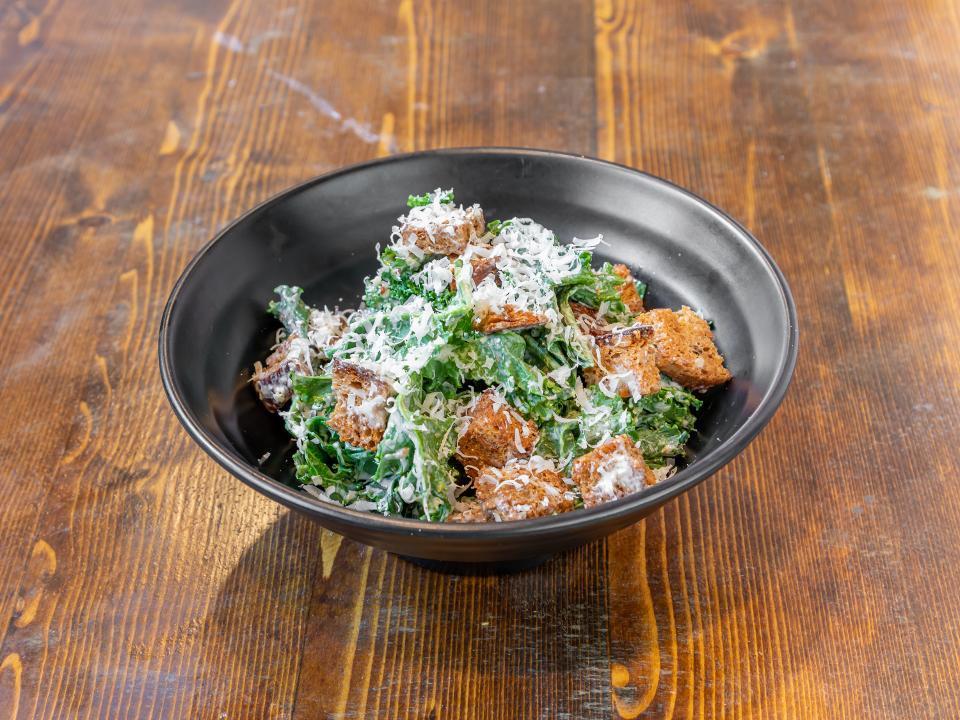 Kale Caesar Salad · mixed kale, croutons, parmesan, with creamy caesar dressing