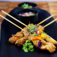 4 Piece Chicken Satay · Thai marinated in mixed herbs served with delicious peanut sauce and pickled Thai cucumber r...