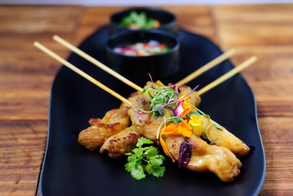 4 Piece Chicken Satay · Thai marinated in mixed herbs served with delicious peanut sauce and pickled Thai cucumber relish. Contains nuts.