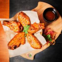 Thai Chicken Wings · Served with sweet chili sauce. Mild spicy.