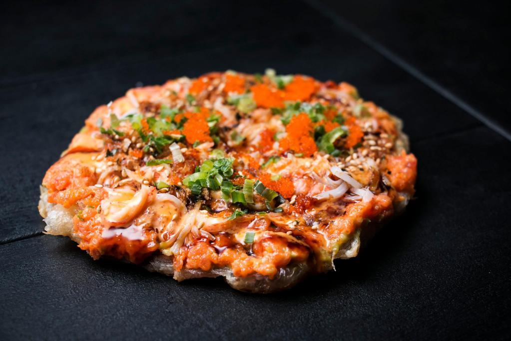 Spicy Tuna Pizza · Served with kani, crunch, furikake flakes, caviar, eel sauce and spicy mayo.