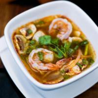 Tom Yum Soup · Spicy lemongrass shrimp broth with fresh mushrooms, onion, tomato, scallion, cilantro and li...