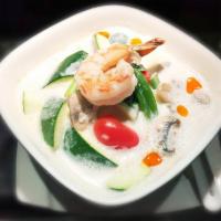 Tom Kha Soup · Coconut cream broth with fresh mushrooms, onion, tomato, scallion, cilantro and lime.