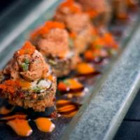 Volcano Roll · Fried white fish topped with seared spicy tuna, caviar, scallions, spicy mayo and eel sauce.