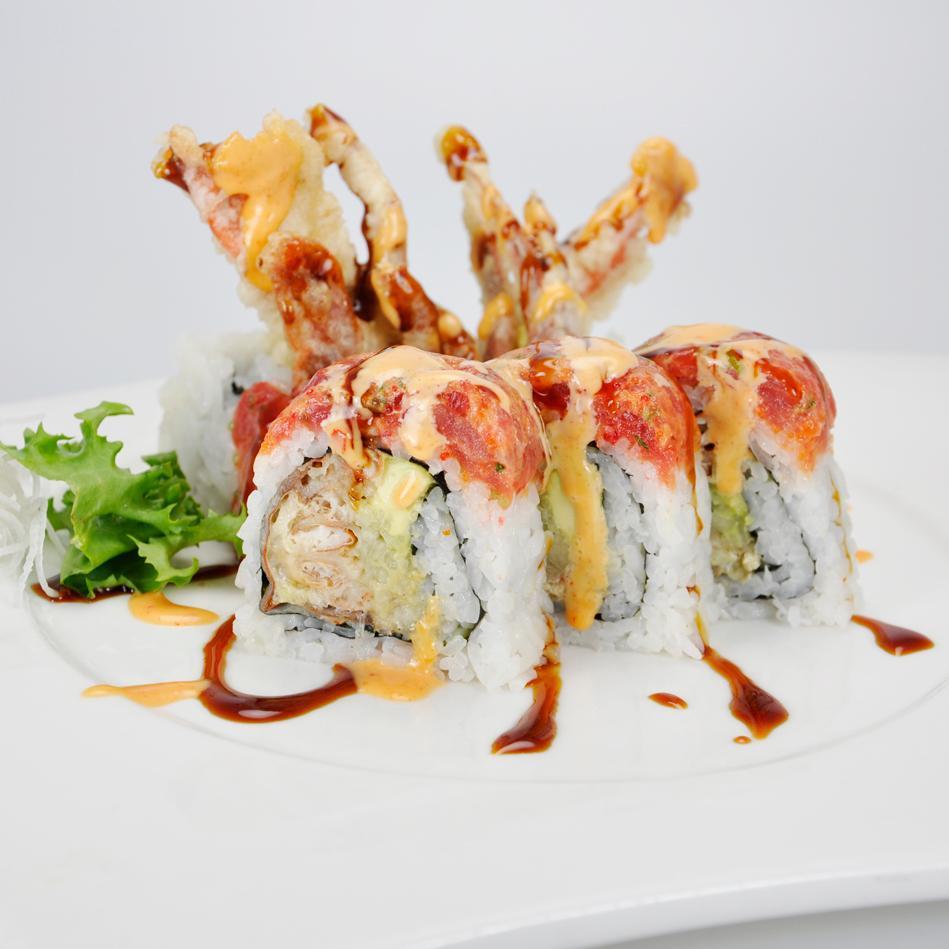 Dancing Spider Roll · Soft shell crab, avocado and cucumber inside, topped with spicy tuna, spicy mayo and eel sauce.