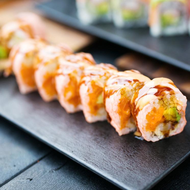 Pink Lady Roll · Spicy salmon, shrimp tempura, avocado, cucumber and caviar, wrapped in pink soy paper, spicy mayo and eel sauce.