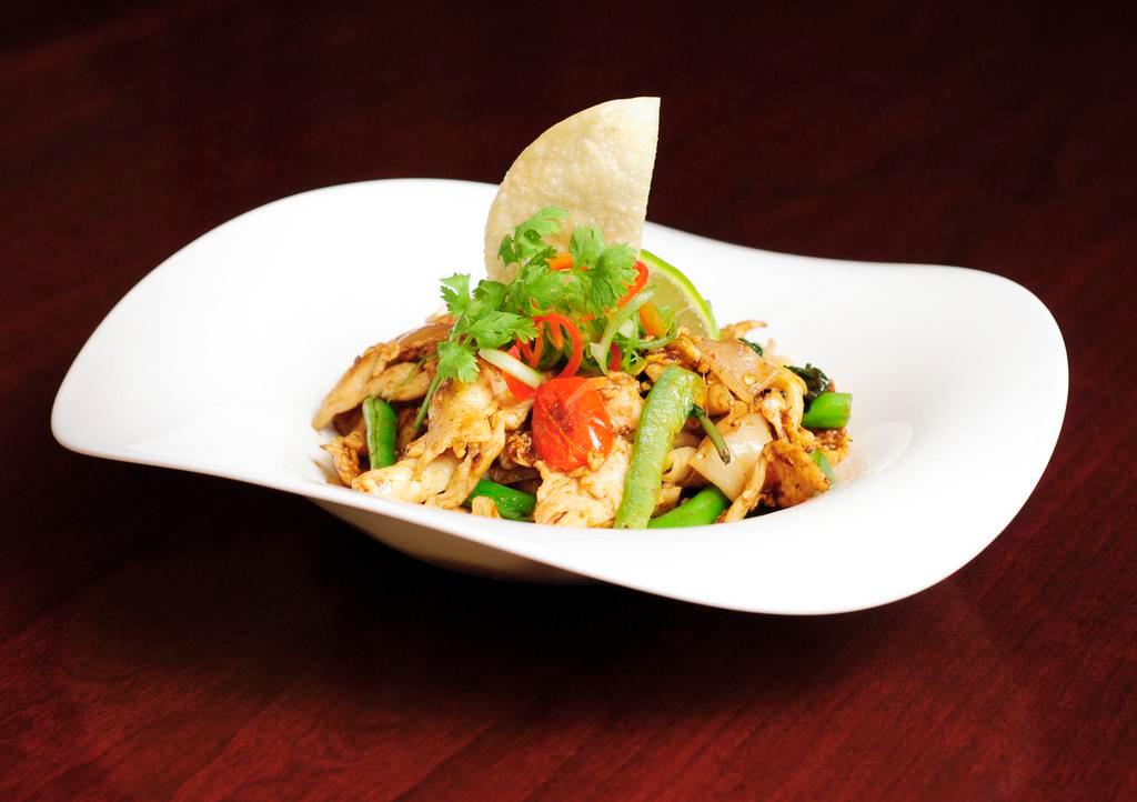 Drunken Noodle · Stir fried wide noodles with egg, basil, onion, carrot, bell pepper, string beans in a chili garlic puree. Medium spicy.