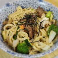 Yaki Udon Noodle · Stir fried thick udon noodles with cabbage, carrots, broccoli and mushrooms in a sesame soy ...