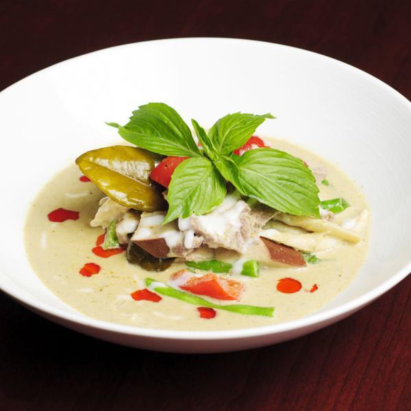 Green Curry · Fragrant coconut green curry with basil, string bean, bamboo shoot, eggplant and bell peppers. Hot spicy.