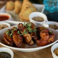Tamarind Hot Wings. · Beaverton Exclusive. Burmese Home Style Tumeric fried chicken wings 