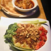 Kneaded Fish Rice. · Tilapia, Fresh Tomatoes, Garlic, Spiced Potatoes, and Tumeric kneaded with Jasmine Rice to f...