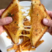 CLASSIC GRILLED CHEESE · Cheddar, Gruyere, White Bread, Fries.  