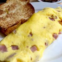 HAM & GRUYERE OMELET · Cured Ham & Gruyere Cheese.  Served with a choice of Brioche, 7 Grain or Rye Toast.