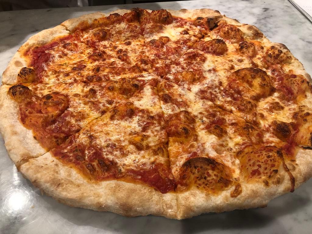 The Rita Pizza (cheese pizza) · Tomato, mozzarella and basil.