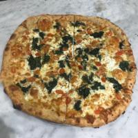 Spinach Ricotta Pizza · Spinach, tomato, ricotta, mozzarella, garlic and basil.