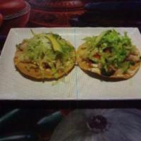 Tostada de Camaron  · Hardened flat tortilla with shrimp, lettuce, cheese, and avocado