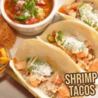 Shrimp Tacos · 3 delicious lightly breaded and grilled shrimp tacos in your choice of tortillas filled with...
