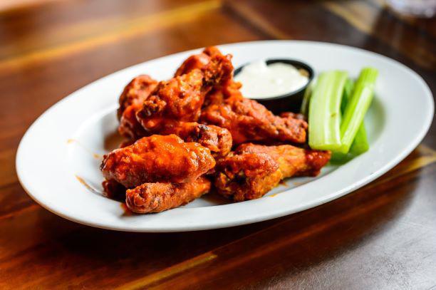 Chicken Wings · 8 Pieces of our Famous Wings. Choose your flavor: Barbecue, Buffalo, Cajun, or Garlic Parmesan. Comes with choice of Ranch or Bleu Cheese and Celery Sticks.