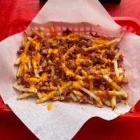 Bacon Cheddar Fries · A generous portion of our Garlic Fries smothered in cheddar cheese sauce and topped with bac...