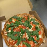 Margherita Pizza · Red Sauce with Fresh Mozzarella slices, Tomato, and Fresh Basil
*Thin Crust Not Available in...