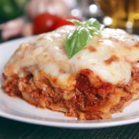 Meat Lasagna · Generous portion of our delicious meat Lasagna, served with two pieces of Garlic Toast.