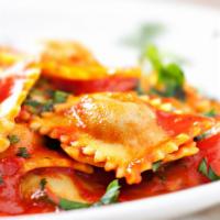 Cheese Ravioli · Our Ravioli has a four cheese blend and is served with Marinara and two pieces of Garlic Toa...