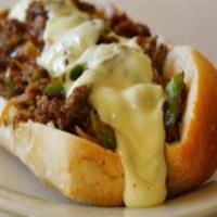 Philly Cheesesteak · Sliced Beef, Bell Pepper & Onion smothered with white American Cheese. Classic Philly