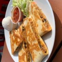 Quesadilla · Flour tortilla filled with cheddar jack, diced tomatoes, olives, salsa, sour cream, add beef...